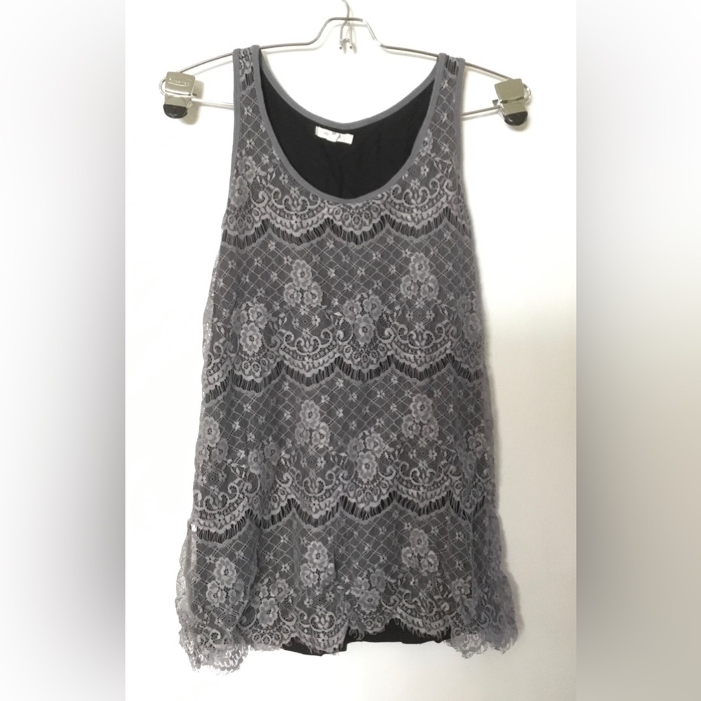 Lacy sleeveless top.